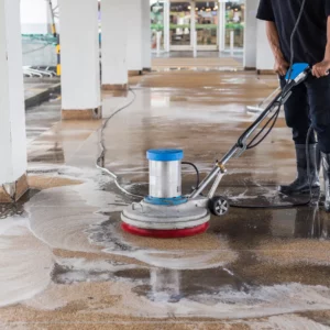 asian-worker-cleaning-sand-wash-exterior-walkway